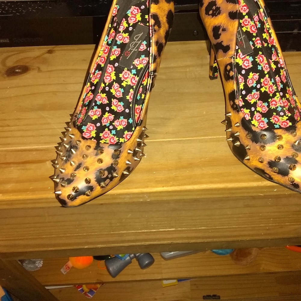 Leopard print spike and stud iron fist pumps